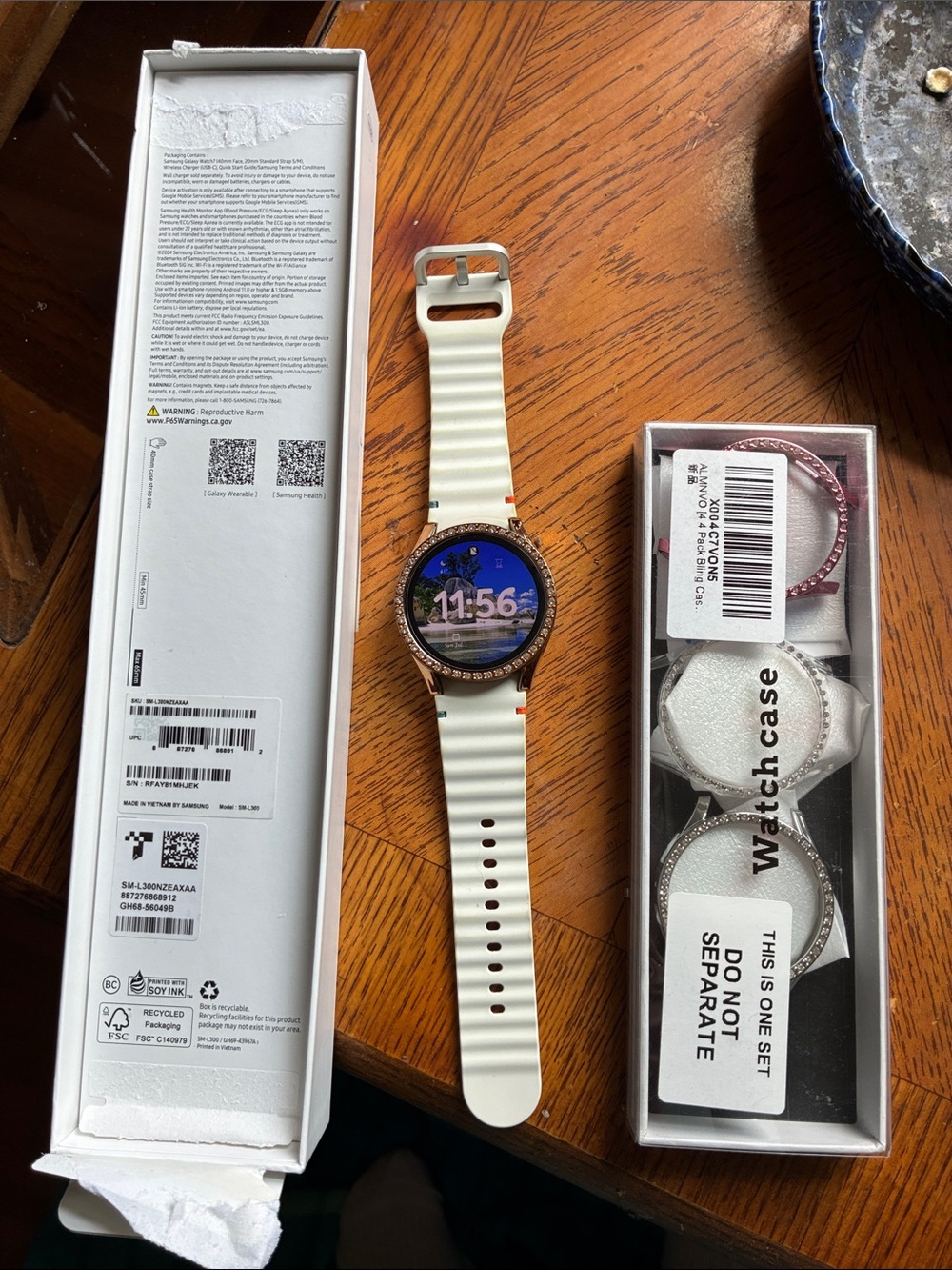 Samsung White Silicone Smartwatch with Rose Gold Crystal Bezel and Extra Bezels.